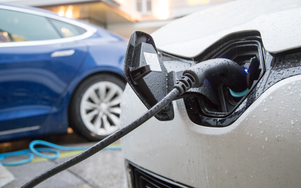 charging ev in the rain ezoo electric car subscription